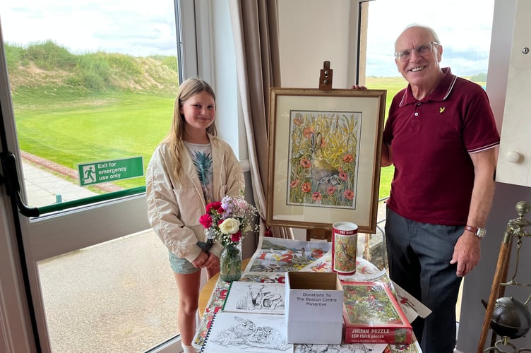 Mike O'Keefe being presented with his prize for winning Ed's Birthday Bash