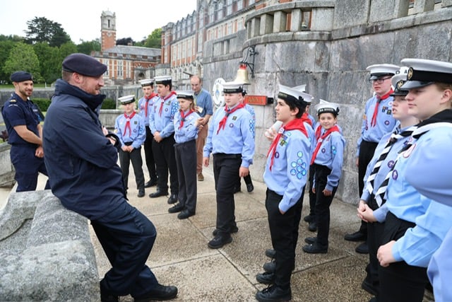 Britannia Royal Naval College Captain Andrew Bray talks with Watchet sea scouts during their visit.