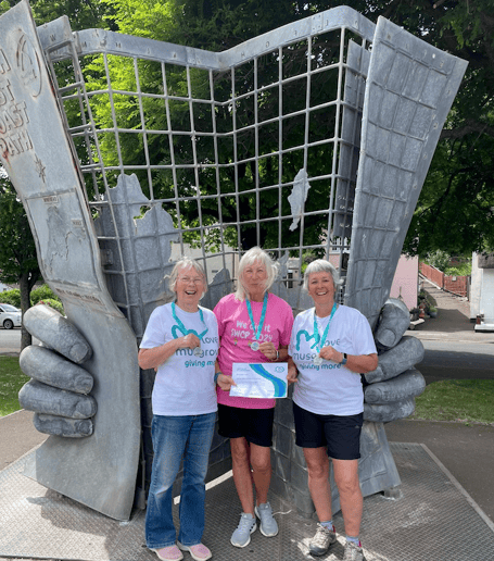 South West Coast Path walkers (left to right) Carol Matravers, Carolyn Cape,  and Hazel Binding with their medals and certificates at the path's starting point in Minehead.