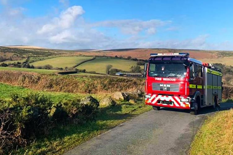Dozens of firefighters tackled a blaze in a remote area between Stogursey and Holford. PHOTO: DSFR.