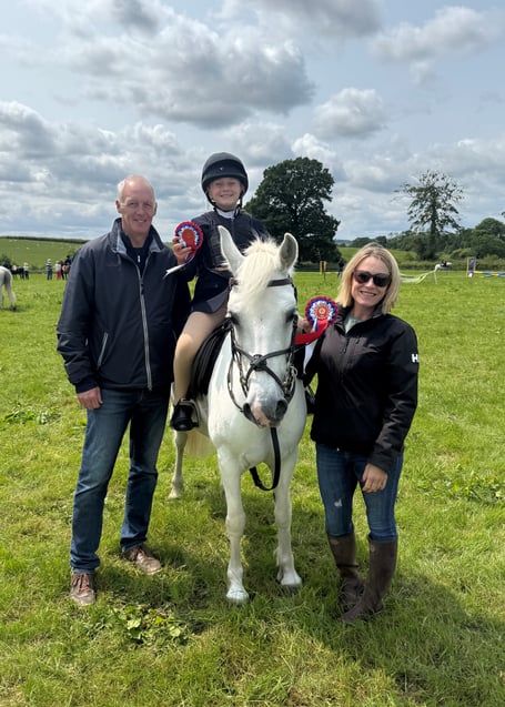 Martha Pipe and her proud parents after two first places at Tiverton