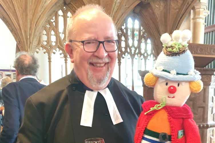 Archdeacon Emeritus Elwin Cockett presented with the raffle prize by Marion Jeffrey at this year's St Petrock’s Patronal Feast