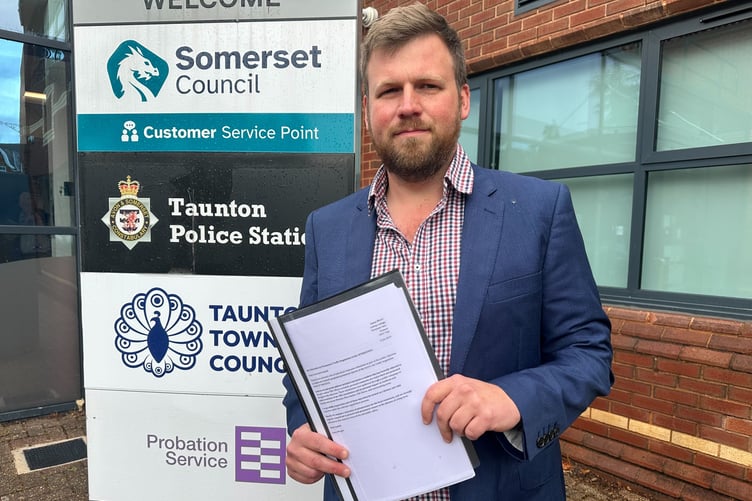 James Wright delivers to Somerset Council more than 1,000 objections to its plans to permanently close the B3191.