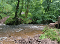 Bridge swept away as storms cause flooding