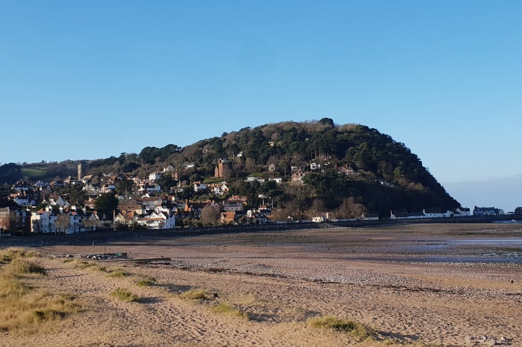 North Hill towers over Minehead, where a debate is ongoing about funding an online visitor information service.