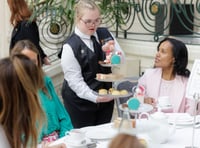 Hospitality students serve afternoon tea in iconic London hotel