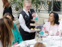 Hospitality students serve afternoon tea in iconic London hotel