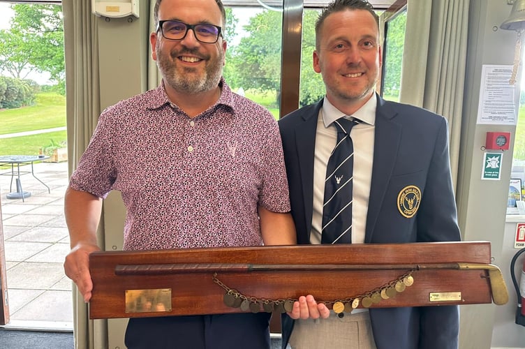 Enmore captain Craig Wright (right) presents the Captain's Putter to Stewart Hayter