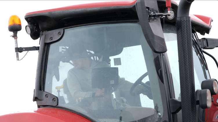 Nathan Hewitt, of Watchet, in the cab of his tractor as he continues his farming career despite a lower leg amputation. PHOTO: Stride Forward.
