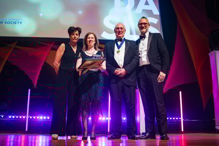 Claire Lovett (middle left) of Amicus Law collects the Employer of the Year award