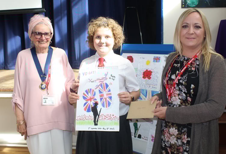 Danesfield Middle School pupil Chloe Wickens receives her VE Day artwork prize from Watchet Mayor Cllr Loretta Whetlor (left) and town clerk Jo Grellier.