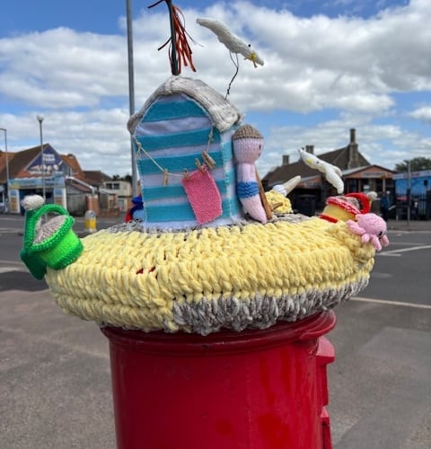 A seagull pinches a chip on this WI postbox topper
