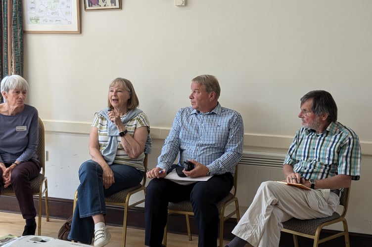 The panel: Susan Mew (chair of Carhampton Climate Group), Brenda Maitland-Walker (chair of Carhampton Parish Council), Chris Winter (local developer) and Vernon Hughes (CPRE).