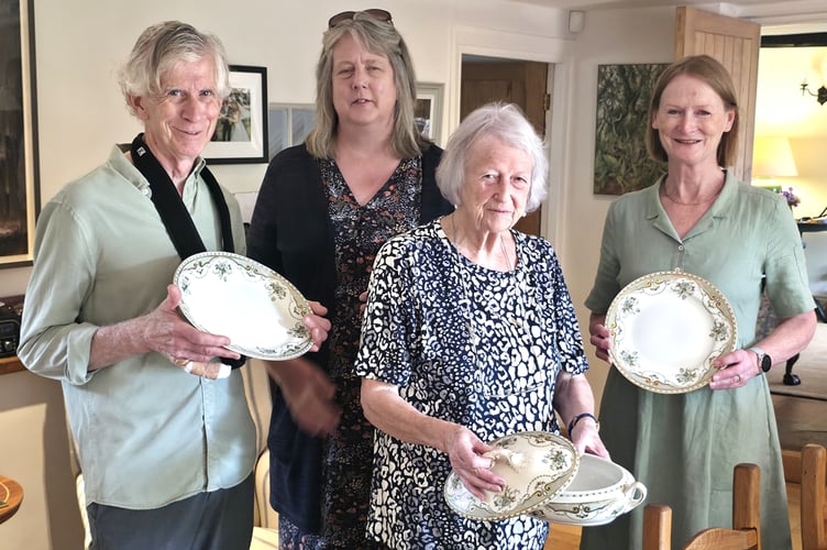 Tom Sperling, Andrea Jackson, Jan Harrower and Marion Jeffrey holding some items from the dinner service