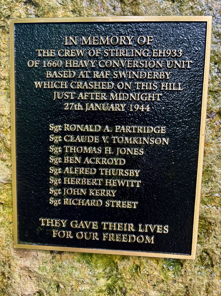 The bronze plaque commemorating the lives of the Sterling EH933 crew