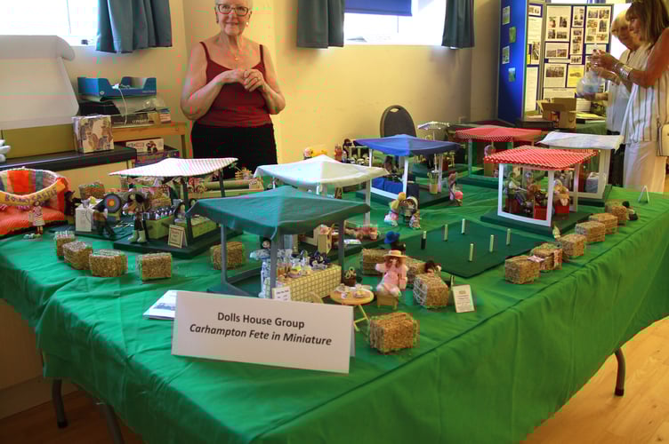 While the real thing was happening outside in baking heat, a replica of Carhampton's annual fete could be enjoyed indoors courtesy of the village's dolls house group. PHOTO: George Ody.