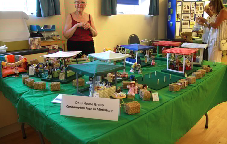 While the real thing was happening outside in baking heat, a replica of Carhampton's annual fete could be enjoyed indoors courtesy of the village's dolls house group. PHOTO: George Ody.