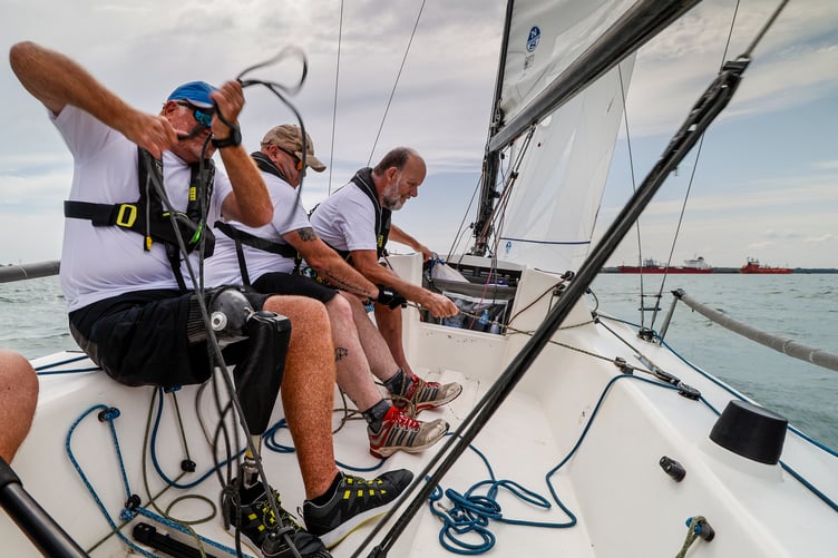 Some of the Stride Forward racing yacht crew pulling in the main sheet during practice for Cowes Week. PHOTO: Paul Wyeth.