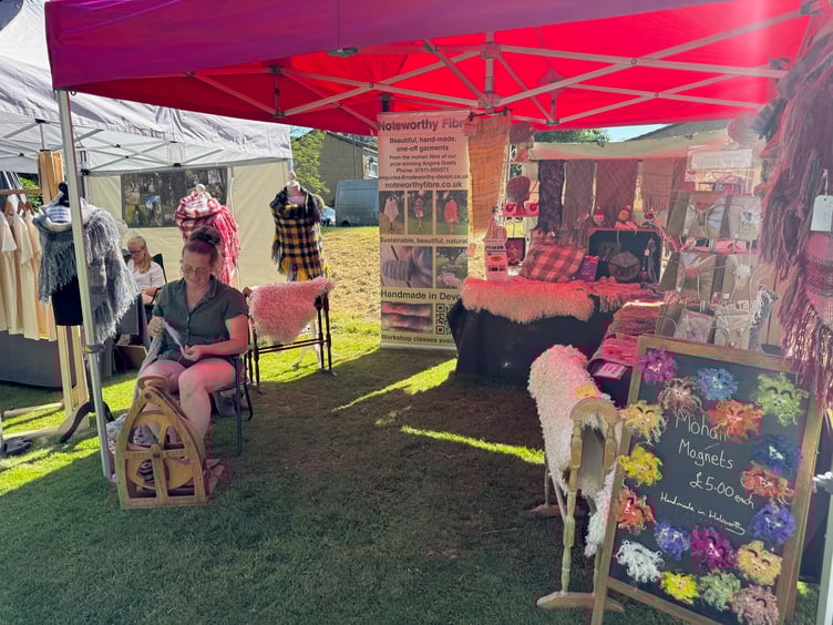 Spinning mohair from Angora goats was demonstrated at the artisan food, drink, and crafts festival in Dulverton. PHOTO: Visit Dulverton.