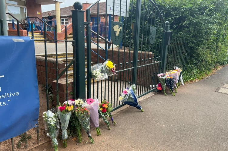 Floral tributes left outside Minehead Middle School, July 18 2025