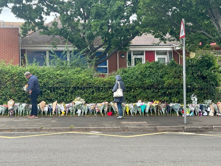 Floral tributes, stuffed toys and messages have been left outside the gates of Minehead Middle School in Somerset, following the tragic bus crash that killed a pupil on July 17 2025. Floral tributes have been left outside a school after a fatal bus crash that killed a pupil. One child died and 21 people were injured after the coach slid 20ft down an embankment during a day trip from Minehead Middle School in Somerset. Two other children were airlifted to hospital with serious injuries following the horrific crash on the A396 at around 3pm on Thursday. The 70-seater vehicle was taking pupils back from a zoo when it came off road Wheddon Cross.