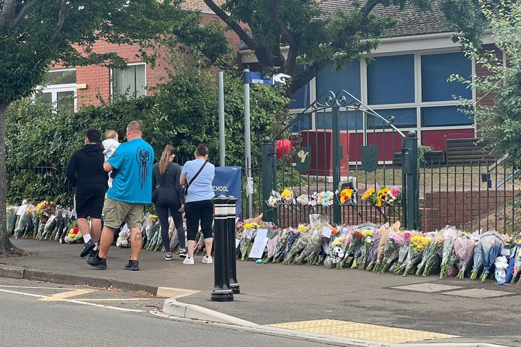 Floral tributes, stuffed toys and messages have been left outside the gates of Minehead Middle School in Somerset, following the tragic bus crash that killed a pupil on July 17 2025. Floral tributes have been left outside a school after a fatal bus crash that killed a pupil. One child died and 21 people were injured after the coach slid 20ft down an embankment during a day trip from Minehead Middle School in Somerset. Two other children were airlifted to hospital with serious injuries following the horrific crash on the A396 at around 3pm on Thursday. The 70-seater vehicle was taking pupils back from a zoo when it came off road Wheddon Cross.