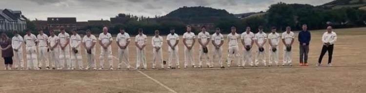 The players of both Minehead and Chard cricket teams observe a minutes silence in memory of the Minehead Middle School pupil who died in the coach crash two days earlier