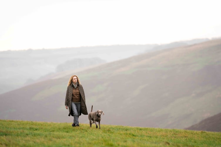 Mirja Turestedt, as Maria Holinek, walking on Exmoor with her dog Castor for the Swedish film 'Unmoored'.