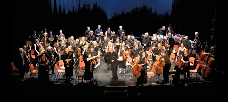 Members of the Minehead and Exmoor Music Festival 2025 orchestra take a bow.