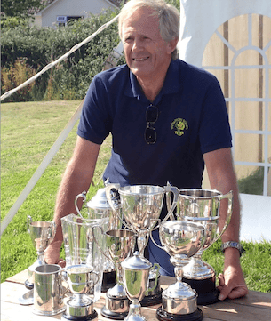 Chris Yates collects his haul of 10 trophies from Bicknoller Summer Flower Show. PHOTO: Andrew Harrison.