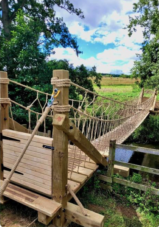 A Treehouse Life-built rope bridge.