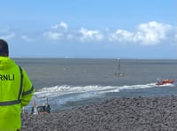 Lifeboats and helicopter in dramatic coastal rescue