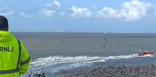 Lifeboats and helicopter in dramatic coastal rescue