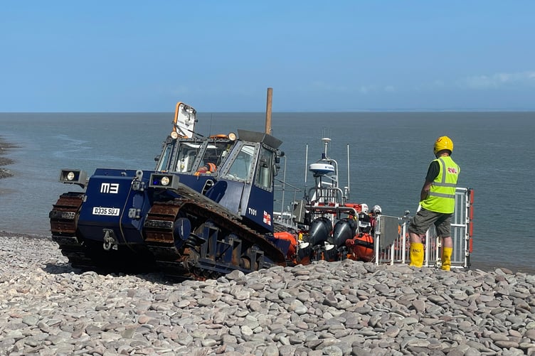 Minehead RNLI's Atlantic 85 lifeboat is recovered after Saturday's call to rescue two stranded walkers.