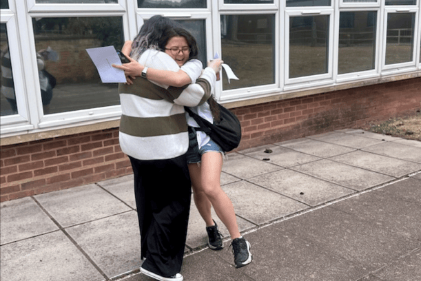 Kyra Davies (left) and Sundari Scarborough celebrate on A Level results day in West Somerset College.