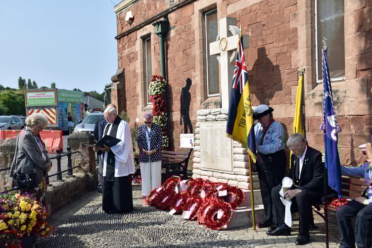 Father Vincent Woods leads a VJ Day service at Wathet War Memorial.