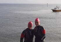 Pair make first-ever swim from Minehead to Porlock Weir for cancer charity