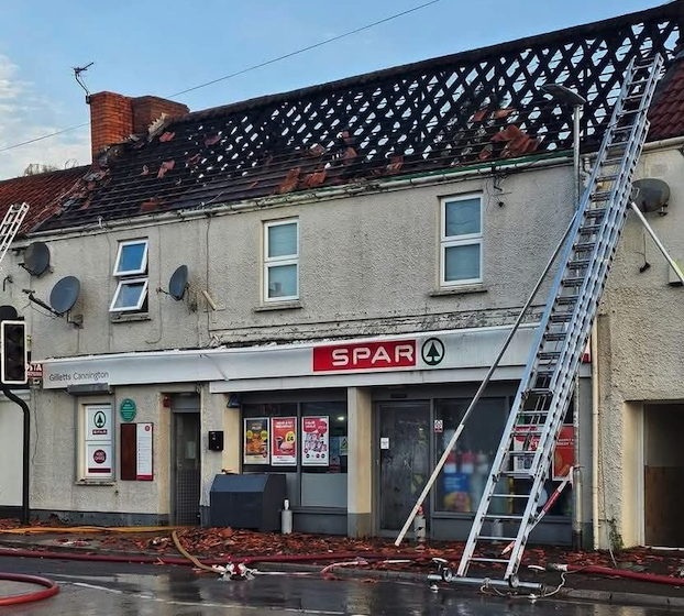 The damage caused by Saturday's fire to the roof of a flat above the Spar shop in Cannington can clearly be seen.