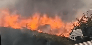 Two major fires threaten homes in tinder dry conditions