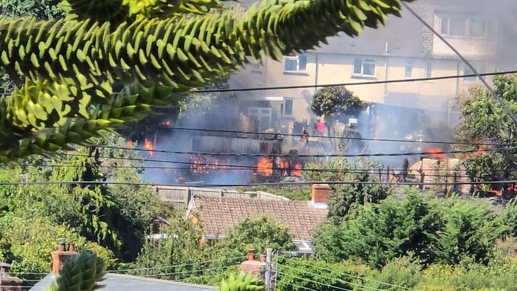 A fire in Washford spread through the back gardens of 18 properties on Monday.