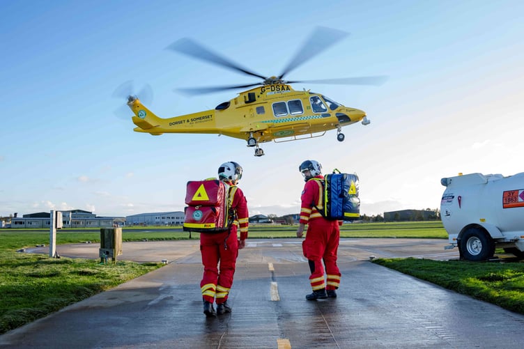 The Dorset and Somerset Air Ambulance helicopter and crew members.