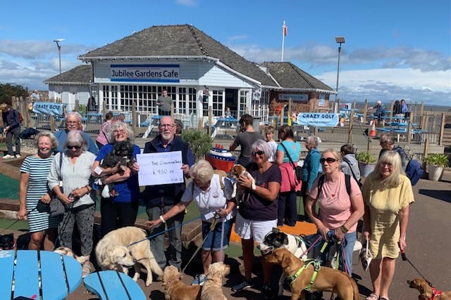 A £950 cheque is presented by Exmoor Freemasons to the Cinnamon Trust.