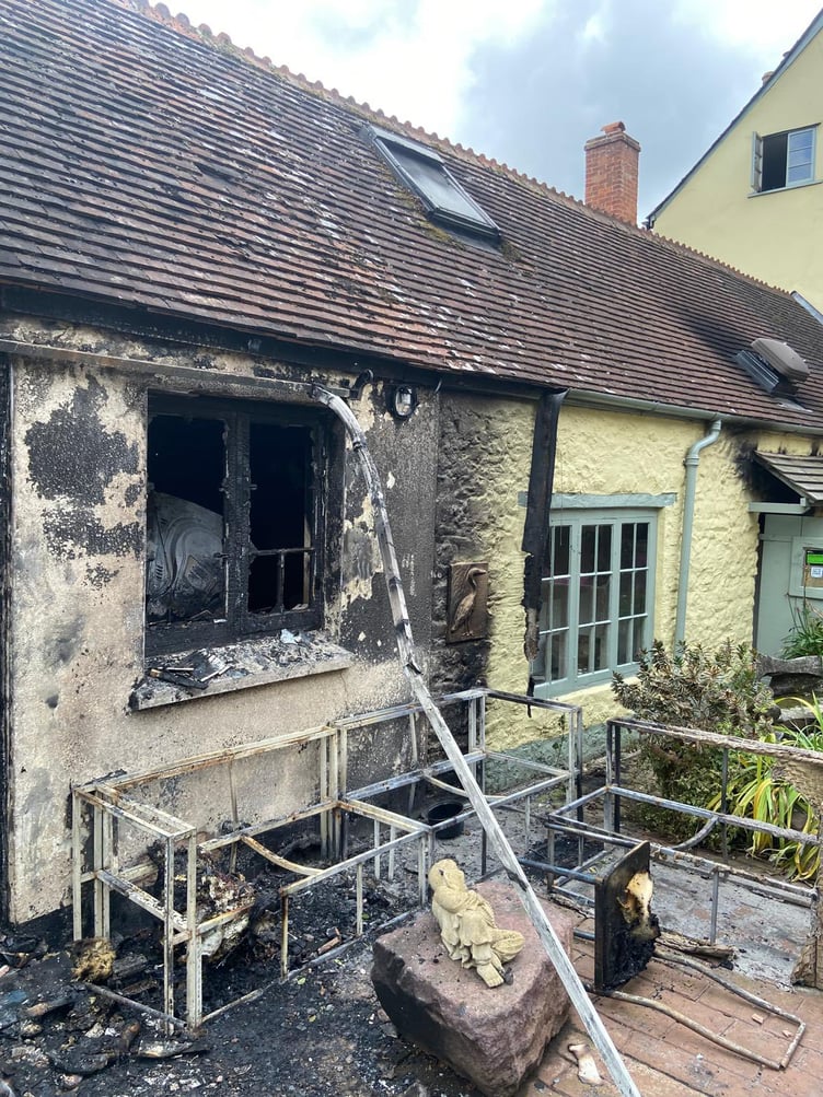 Fire damage can be seen at the rear of Reeves restaurant in Dunster.