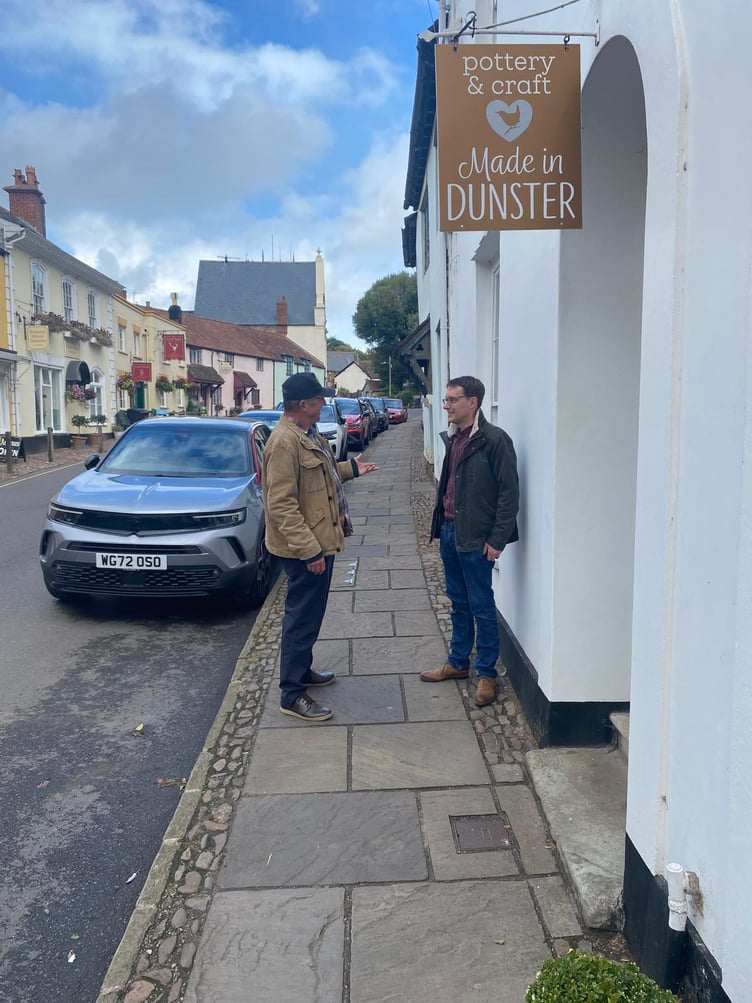 James Bellamy (right) meets residents in Dunster this week as he prepares to stand in a by-election for Somerset Council.
