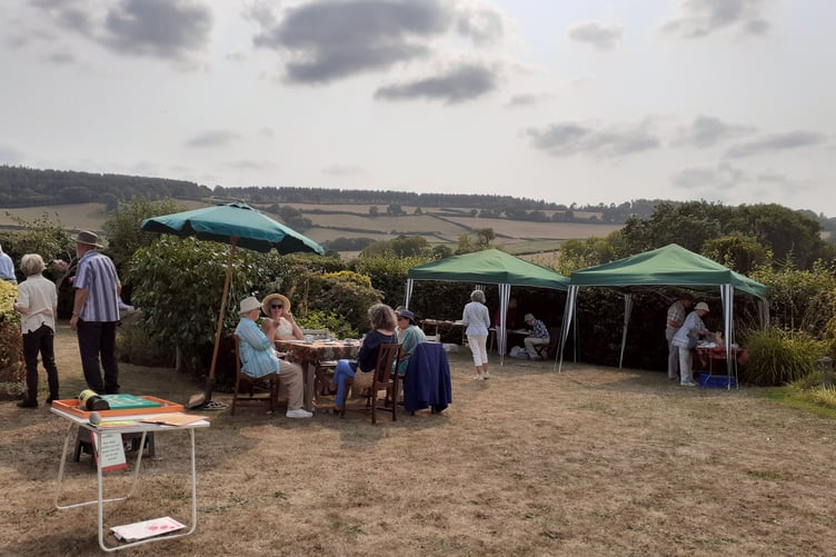 A tea party in a Carhampton garden raised funds for Amnesty International.