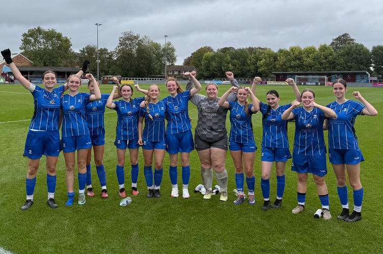 Minehead celebrate after their fine victory away to Taunton Town