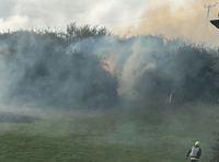 Power cables fall to ground and start fire threatening homes