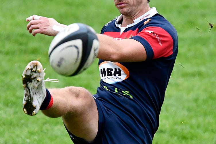 Dan Quick kicks for Wiveliscombe in the recent cup match against Bridgwater & Albion