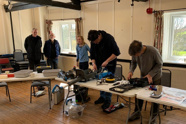 Volunteers at work in an earlier Wiveliscombe Repair Café session.