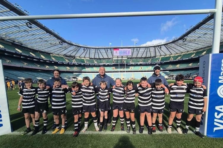 Pictured between the posts at Twickenham are: Joshua Wyatt, Ronnie Harris, Amelia Westwood, Rupert Barrass, Sam Blackmore, Martha Ford, Henry Ellicott, William Sellick, Jack Barry, Teddy van Wyk , Liam Floyd and Toby Blackshaw  